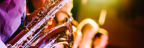 Close up of a saxophone under spotlights at a concert