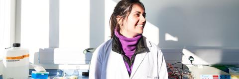 smiling female romanian student in a lab