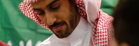 male saudi arabian student pouring tea at festival of culture 2017