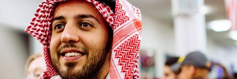 a male student from UAE at a festival of culture 