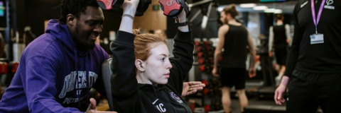 Person exercising using free weights