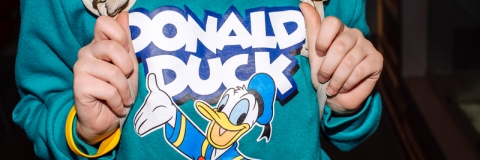Young woman wearing Donald Duck sweatshirt