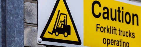 Forklift operation warning sign, mounted on exterior wall