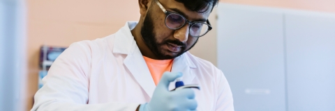 A student working in the Biochemistry and Biology lab