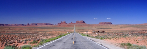 Road leading away from viewer in Monument Valley
