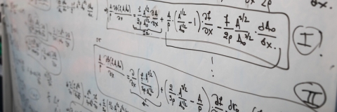 Mathematical equations on a whiteboard
