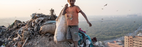 Boy in Delhi, India, collecting rubbish
