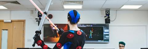 Student in motion capture suit in the studio