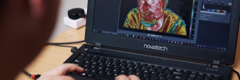 University of Portsmouth student playing around with thermal imaging on a computer