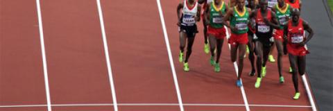 Mo Farah and other professional athletes running a race on a track