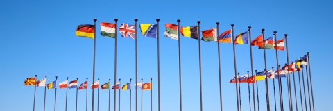 Flags of the world against blue sky