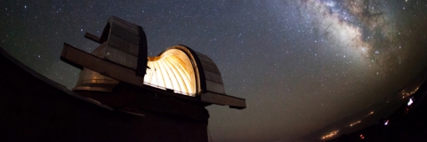 A space telescope in operation against a starry sky