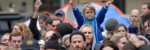 Young child holding sign at a climate change protest