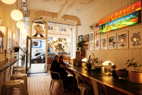 Interior shot of diners eating at long table
Hideout Coffee - City Guide 2022