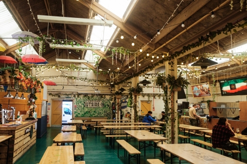 Wide shot of tables at Outside-in Food Court
Outside-In Food Court - City Guide 2022