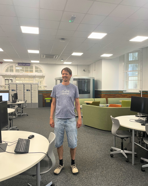 Hagen in the Park Building computer lab, stood in the same spot he sent his first email to the coursemate who would later become his wife
