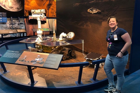 Dr Lucy King looking at the Mars exhibit in NASA, California
