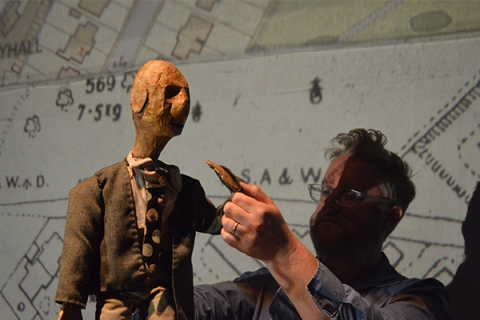 Researcher Matt Smith positions a large puppet at a practice-as-research event © Walid Benkhaled
