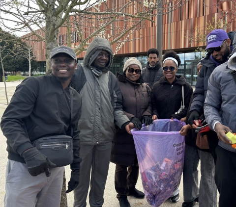 Group posing with collected rubbish bags outside of Ravelin