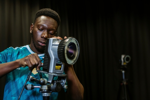 A person using a device with a wide lens