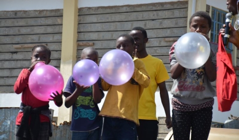 image of african children blowing balloons