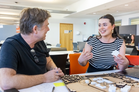 image of Architecture student explaining work to academic in the architecture studios