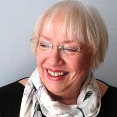 Headshot of Maggie Winchcombe smiling to camera