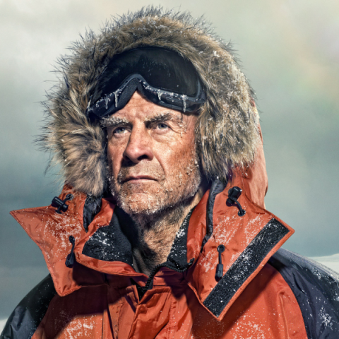 Image of Sir Ranulph Fiennes wearing coat with furry hood on headshot