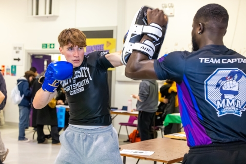 University of Portsmouth students holding a kickboxing taster session at Freshers Fayre