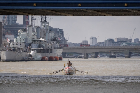 A rowing boat underneath Tower Bridge, London