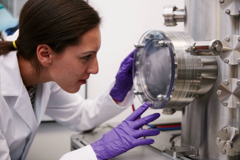 Female student working with machinery 