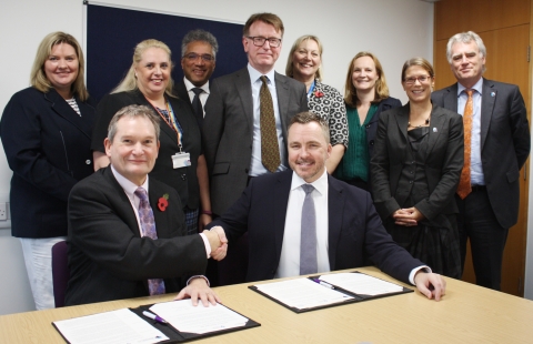Professor Graham Galbraith and Mark Cubbon signing the partnership agreement
