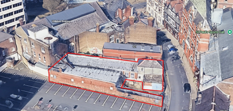 Aerial street view, with red outline to show the building to be demolished