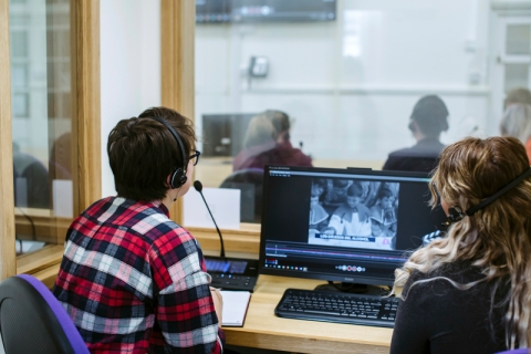Modern Foreign Languages Students at language learning facility watching a video on a computer
