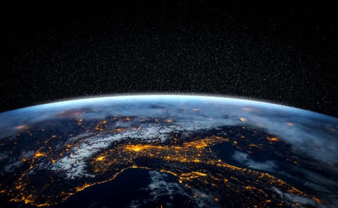 Close up of the earth from space at night with street lights visible