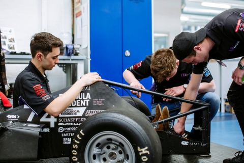 Students working on Formula Student race car