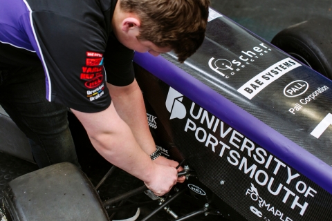 Engineering Project Day, 30th April 2019; student working on formula student race car