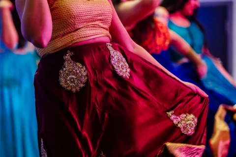 Woman in long Indian style skirt dancing