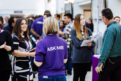 Postgraduate students and staff at an open evening
