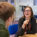 A Careers Advisor with a student, smiling 
