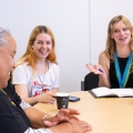 Three women smiling
