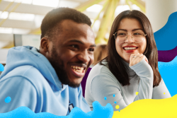 Two students smiling