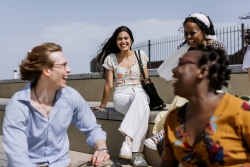 International students are chatting and laughing outdoors