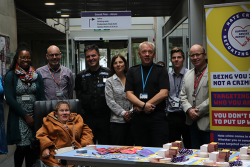 group of people standing together at Hate Crime Awareness Week event