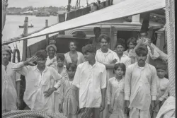The captain and crew on board the Indian kotia type dhow Karimi (fl.1938) anchored at Colombo, Ceylon (by David Watkin Waters) P34317 © National Maritime Museum, Greenwich, London
