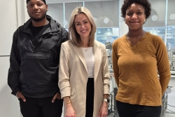 Three people stood in a line