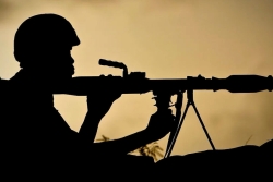 Silhouette of soldier with rifle