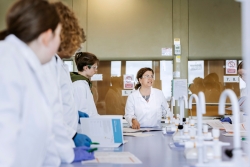 Photo of female staff member in lab coat presenting experiment
Salter Festival of Chemistry