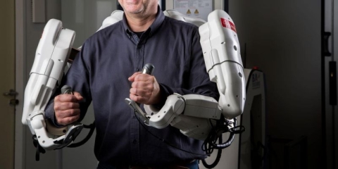 Human wearing and controlling robot skeleton