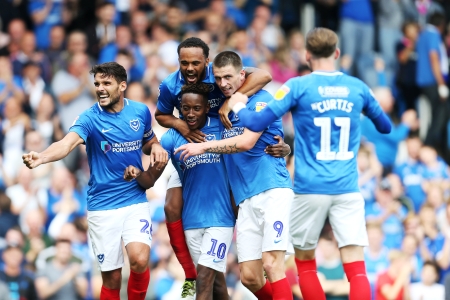 Portsmouth Football Club players celebrating a goal